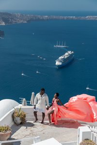 Love story photoshoot with flying dress Santorini